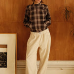 female model wearing cream speltham corduroy lounge trousers