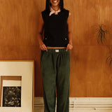 female model wearing speltham dark green corduroy lounge trousers