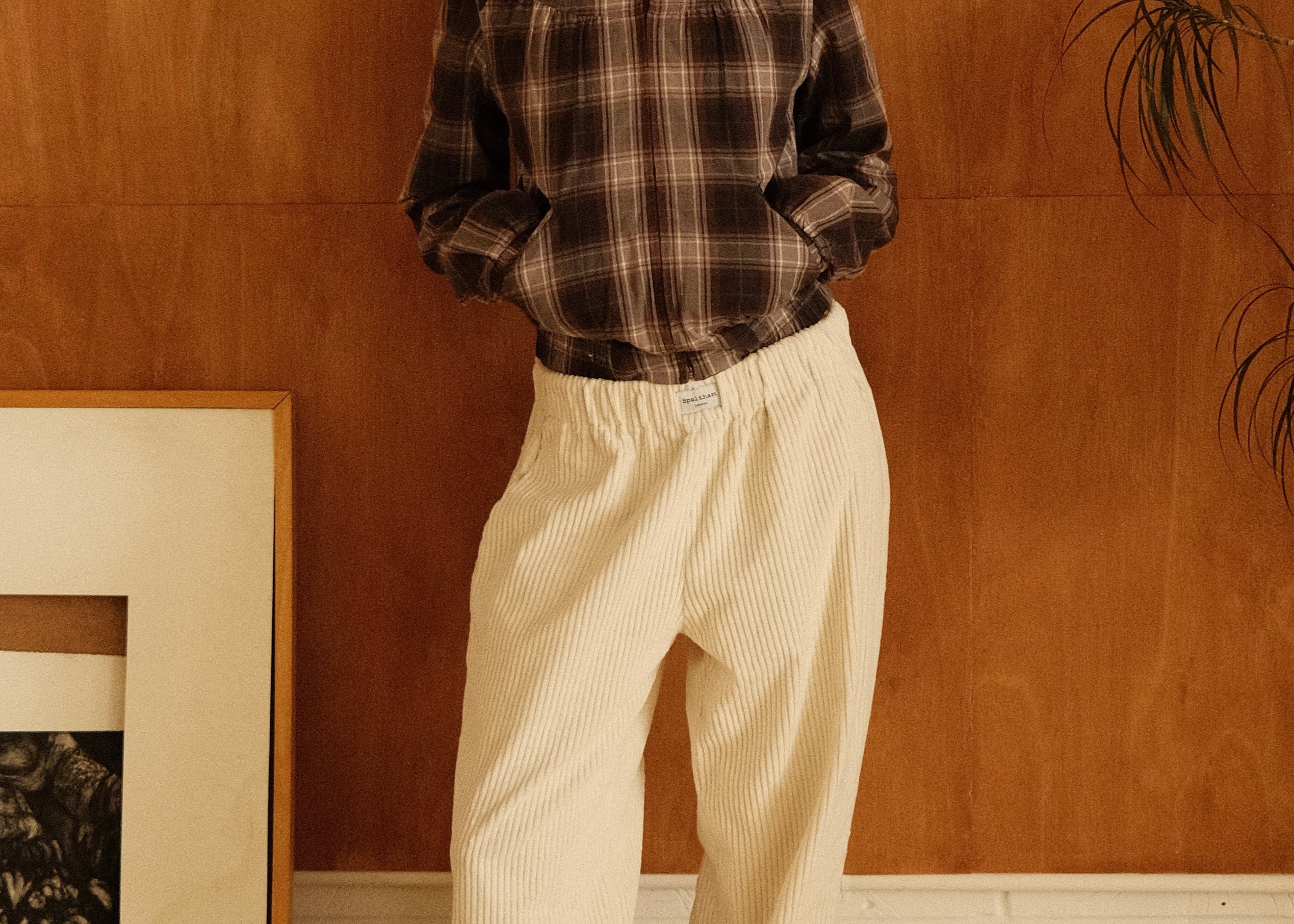 female model wearing cream speltham corduroy lounge trousers