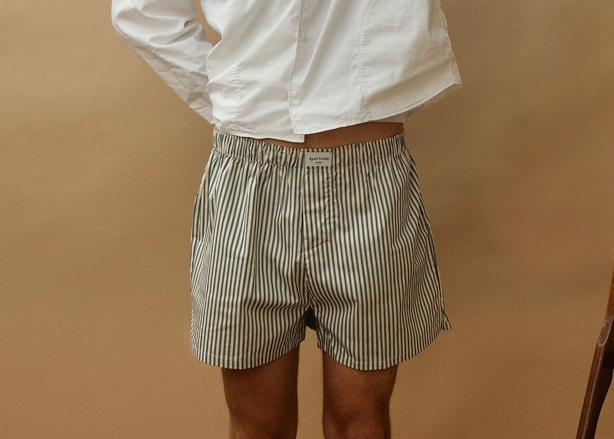 Striped unisex boxer shorts with Speltham label, paired with white shirt for casual loungewear