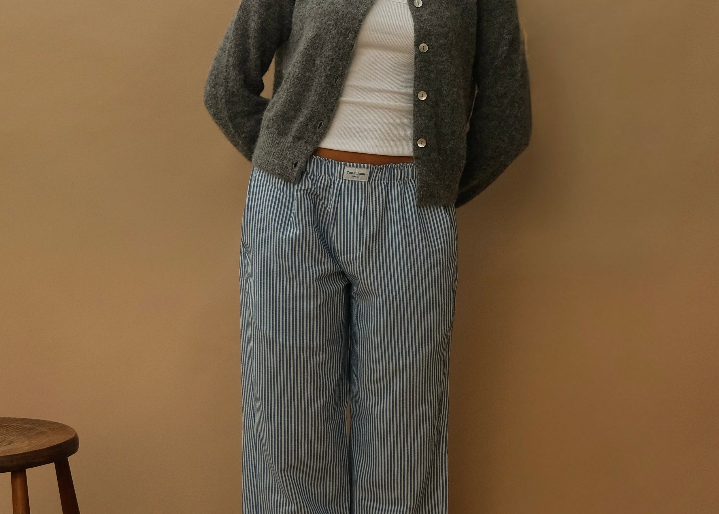 female model wearing blue striped speltham lounge pants