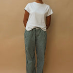 female model wearing green striped speltham lounge pants