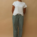 female model wearing green striped speltham lounge pants