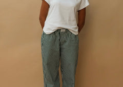 female model wearing green striped speltham lounge pants