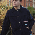 male model wearing speltham navy corduroy jacket