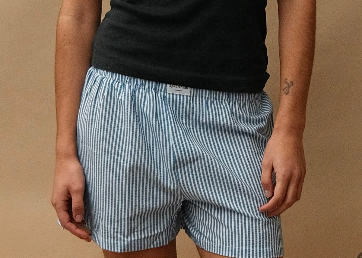 female model wearing speltham navy unisex seersucker boxer shorts