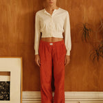female model wearing orange speltham corduroy lounge pants