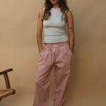 female model wearing red striped speltham lounge pants